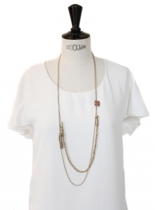 Long gold chain necklace with a coral pink stone