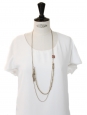 Long gold chain necklace with a coral pink stone