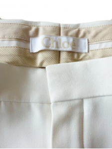Cream beige wool pleated straight-leg tailored trousers Retail Price 1250€ Size 42
