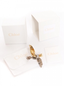Bracelet noeud en laiton doré et argent ivoire Prix boutique 5800€