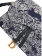 Saddle clutch bag in navy blue and cream toile de Jouy printed canvas and leather Retail price €870