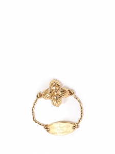 Gold-color metal thin chain ring adorned with flower Sold with dutsbag