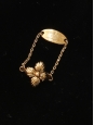 Gold-color metal thin chain ring adorned with flower Sold with dutsbag