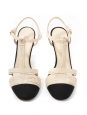 T-bar pumps in cream white leather with black grosgrain and pearl CC logo Retail price €1,200 Size 38