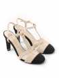 T-bar pumps in cream white leather with black grosgrain and pearl CC logo Retail price €1,200 Size 38