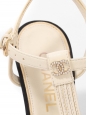 T-bar pumps in cream white leather with black grosgrain and pearl CC logo Retail price €1,200 Size 38
