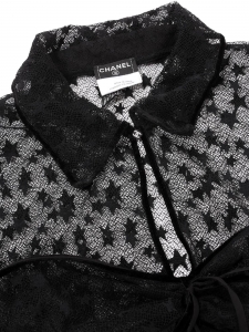 Black knit top with short sleeves, embroidered stars, velvet trim, and CC buttons Fall Winter Retail price €8,500 Size 36