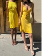Short cocktail dress in bright yellow with plunging V neckline and halter top Retail price €600 Size 36