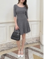 Fit and flare dress with 3/4 sleeves in 100% light gray wool. Retail price €4,400. Size 36.