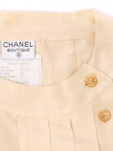 Cream white silk sleeveless top with gold jewelry button Retail price 1200&euro; Size XS